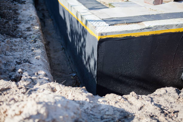 Professional Waterproofing technician working in Halstead, KS